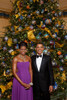 President And Michelle Obama Pose In Front Of The Official White House Christmas Tree Dec. 6 2009. Michelle Wears A Purple Pleated Chiffon Dress With A Corset Lacing Back By Peter Soronen With Tom Binns Necklace. History - Item # VAREVCHISL025EC051