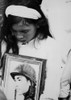 An Young Vietnamese Widow Mourns. Hugging A Photo Of Her Missing Husband History - Item # VAREVCHISL033EC317