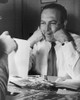 Film Producer Val Lewton Smiling As He Looks At A Photograph History - Item # VAREVCHISL040EC480