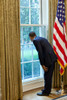 President Barack Obama Looks Out A Window In The Oval Office To See Michelle Obama During Her Interview On The South Grounds Of The White House. Oct. 5 2010. History - Item # VAREVCHISL025EC078