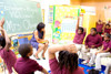First Lady Michelle Obama Chats With Students At The Ferebee-Hope Elementary School In Washington D.C. Michelle Wears A Dark Blue And White Dotted Dress By Lanvin. History - Item # VAREVCHISL026EC034