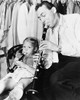 Jazz Musician Woody Herman Playing His Clarinet While His Daughter Ingrid Plays A Plastic Flute. Ingrid Grew Up To Become A Bluegrass Musician And Fiddler. Ca. 1946. History - Item # VAREVCCSUB001CS391