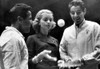 Actress Lauren Bacall Serves Up Ball To Pro Tennis King Pancho Gonzales As Pro Ace Pancho Segura Looks On. February 13 History - Item # VAREVCPBDRIGOCS005