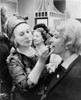 Estee Lauder 1906-2004 Cosmetics Business Leader Dressed In An Yves Saint Laurent Dress Applies Lipstick To A Customer In New York City. 1966. History - Item # VAREVCHISL024EC044