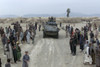 Afghans Mostly Men And Boys Greet Marines On Patrol In A Village Near Kandahar. U.S. And Coalition Forces Entered The Kandahar Region A Month Earlier In Late Nov. 2001. History - Item # VAREVCHISL024EC197