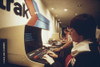 An Amtrak Worker At A Computer Terminal Gets Information On Available Space And Fares And Can Enter Reservations. This New Technology Was Then Available At Only Five Amtrak Locations. Ca. 1972-75. History - Item # VAREVCHISL031EC149