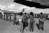 U.S. Air Force Security Police Guard Cuban Nationals As They Board The Airliner Returning Them To Cuba. The Cuban Presence Influenced To U.S. Invasion Of Grenada On Oct. 25 1983. History - Item # VAREVCHISL023EC146