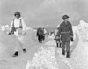 U.S. Soldiers Patrol On A Path Plowed Through Snow In The Ardennes During The Battle Of The Bulge. Some Infantry Men Have Full White Uniforms While Others Have Only Partial Or No Camouflage Covering. Ca. Dec. 26 History - Item # VAREVCHISL038EC059