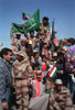 Civilians And Coalition Military Forces Wave Kuwaiti And Saudi Arabian Flags To Celebrate The Retreat Of Iraqi Forces From Kuwait As A Result Of Operation Desert Storm. History - Item # VAREVCHISL023EC198