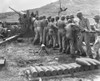 U.S. Marines Cleaning Artillery On Guam Island. Gunners Swab The Bore Of Their Gun During A Lull In Fighting Against The Japanese. July-Aug. 1944 History - Item # VAREVCHISL037EC019