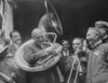 Republican Presidential Nominee Warren Harding Encircled By A Sousaphone. August 1920. This Created An Amusing Image For His 'Front Porch' Campaign In 1920. History - Item # VAREVCCSUB002CS425