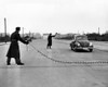 East Berlin Customs Police Stopping A Volkswagen On The Charlettenburger Chaussee With A Tire Puncturing Heavy Barbed Chain. Oct. 26 History - Item # VAREVCCSUA001CS662