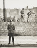 West Berlin Policeman Stands Before The Concrete Block Wall Dividing East And West Berlin. Along Bernauer Strasse History - Item # VAREVCHISL040EC027