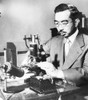 Emperor Hirohito Puts Specimens On A Slide Under The Microscope In His Marine Biology Laboratory. July 31 History - Item # VAREVCCSUB002CS036