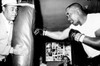 Sonny Liston Working Out On The Heavy Bag While Joe Louis Holds It History - Item # VAREVCPSDSOLICS002