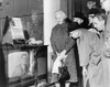 People Gather Around A Television Outside A Store Window On A New York Street As President John F. Kennedy Speaks During A Press Conference On November 21 History - Item # VAREVCHISL020EC147