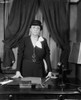 Labor Sec. Francis Perkins Standing At Her Desk. Ca. 1937. She Was The First Woman Appointed To The U.S. Cabinet. As A Loyal Supporter Of Her Friend History - Item # VAREVCHISL035EC384