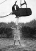 U.S. Marine Officer Enjoys An Early Morning Shower At Cape Gloucester On New Britain. Water Is Provided By Friendly Steam Shovel Operator History - Item # VAREVCHISL038EC598