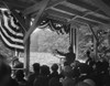 President Calvin Coolidge Speaking To An Outdoors Crowd. He Speaks From A Bunting Decorated Enclosure With Microphones In 1928. History - Item # VAREVCHISL040EC680