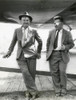 Will Rogers And Wiley Post Before Their Ill-Fated Flying Exploration Of Alaska. The Plane Behind Them Was An Unstable Combination Of A Lockheed Orion Fuselage With Wings From A Different Lockheed Aircraft History - Item # VAREVCHISL039EC292