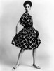 Dress By Pauline Trigere. Short And Full Skirted Dress With A Loose Draped Bodice. The Model Wears Low Heeled Shoes That Replaced The Stilettos Of The Late 1950S And Early 1960S. Csu ArchivesEverett Collection History ( - Item # VAREVCCSUA001CS065