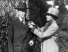 First Lady Grace Coolidge Pins A Red Cross Button On President Calvin Coolidge'S Coat History - Item # VAREVCHBDCACOCS012