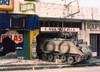 A U.S. Army Armored Personnel Carrier Finds Shelter In A Destroyed Panama City Laundromat. Dec. 1989. History - Item # VAREVCHISL023EC196