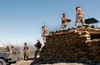 U.S. Army Soldiers Of The 101St Airborne Division Reinforce The Roof Of A Forward Observation Post With Sandbags Near Kabul Afghanistan. May 24 2002. History - Item # VAREVCHISL024EC198