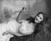 Young Woman Lying On A Sofa And Holding A Burning Cigarette History - Item # VAREVCHCDLCGCEC109