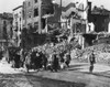 German Civilians Carry Belongings As They Follow An American Soldier Out Of Aachen History - Item # VAREVCHISL037EC771