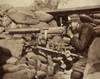 World War 1. Solitary Belgian Soldier In An Advanced Post Aiming A Maxim Machine Gun Against Invading Germans. 1914. History - Item # VAREVCHISL034EC827
