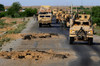 Improvised Explosive Device Blast Holes Created A Few Hours Before This U.S. Army Convoy'S Passing In Southern Afghanistan. Apr.30 2010. History - Item # VAREVCHISL024EC154