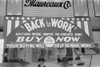 Store Sign Using Economics Theory To Advertise. Sign Reads 'Nation-Wide Drive To Create Jobs' And 'Your Buying Will Help To Make Work'. Maureaux Department Store In Mexican District San Antonio Texas. March 1939. History - Item # VAREVCHISL032EC275