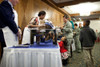 Michelle Obama Talks With A Little Girl While Serving Food To U.S. Air Force Families At Ramstein Air Base In Germany. Michelle Wears A Rose Print Cardigan From Talbots. Nov. 11 2010. History - Item # VAREVCHISL025EC085