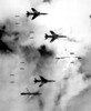 Bombing North Vietnam. Us Air Force F-105 Thunderchief Bomb A Military Target Through Low Clouds Over The Southern Panhandle Of North Viet Nam. June 14 History - Item # VAREVCHISL033EC532
