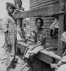 African American Farm Children On The Porch Of Their Home In The Mississippi Delta. Photo By Dorothea Lange History - Item # VAREVCHISL009EC209