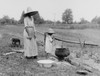 African American Mother And Daughter Boiling Water Over An Outside Fire. Colonial Beach History - Item # VAREVCHISL040EC866