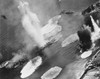 U.S. Carrier Planes Bomb Japanese Cruisers Anchored In The Kure Harbor Naval Base At Honshu. The Warship Under Attack Is Almost Completely Hidden By Water Geysers From Near Misses. July 1945. World War 2 History - Item # VAREVCHISL040EC136