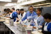 President Barack Obama And His Daughter Sasha Assemble Burritos At Dc Central Kitchen. It Was A Martin Luther King History - Item # VAREVCHISL039EC772