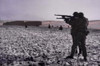 U.S. Soldier Fire At German Troops During The Fight For Bastogne History - Item # VAREVCHISL037TX269