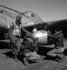 A Tuskegee Fighter Pilot And Two Airmen Adjusting An External Seventy-Five Gallon Drop Tank On The Wing Of A P-51D Mustang History - Item # VAREVCHCDWOWAEC026