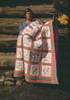 Mrs. Bill Stagg Displays Her 'State Quilt' In Front Of Her Log Home In Pie Town New Mexico. The Quilt Had Embroidered Panes Of Each Of The 48 Us States. Oct. 1940. History - Item # VAREVCHISL032EC290