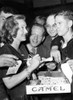 Bette Davis Hands Out Autographs And Cigarettes To Grateful Servicemen At The Hollywood Canteen History - Item # VAREVCPBDBEDAEC071