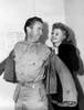 Rita Hayworth Helps A Lucky Soldier Into His Jacket At The Hollywood Canteen History - Item # VAREVCPBDRIHAEC100