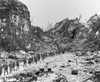 Column Of Marines Moves To The Front Lines Through The Rocky Terrain Of Peleliu Island. Ca. Sept.-Nov. 1944. World War 2 History - Item # VAREVCHISL036EC702