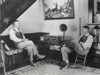 Middle Aged Farmer And His Adult Son Listening To The Radio In Their Comfortable Home History - Item # VAREVCHISL043EC240