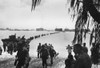 Army Reinforcements Wade Ashore On Saipan Without Enemy Opposition. They Will Relieve Marines In The Battle Of Attrition Raging In The Island'S Interior. The Ships Of Task Force 58 Are Behind Them In The Pacific Ocean. - Item # VAREVCHISL036EC573