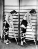 Two Adult Women Polio Victims With Leg Braces Adjust Their Crutches. They Are At The New York Institute Of Physical Medicine And Rehabilitation Where They Are Undergoing A Six Month Training Program. Aug. 7 History - Item # VAREVCCSUA001CS001