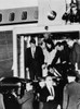 John Kennedy'S Coffin. Robert Kennedy Holds Jacqueline Kennedy'S Hand As They Watch The Body Of The Assassinated President Removed From Air Force One To An Ambulance. Andrews Air Force Base History - Item # VAREVCHISL033EC943