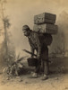 Turkish Porter Carrying Luggage On His Back. Studio Portrait With Painted Backdrop Of Landscape With Mosque History - Item # VAREVCHISL022EC006